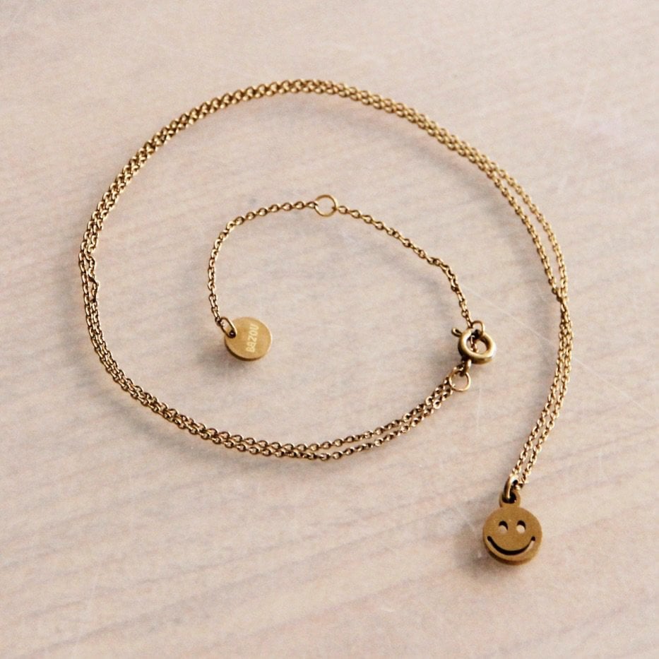 RVS Edelstalen fijne ketting met smiley - goud