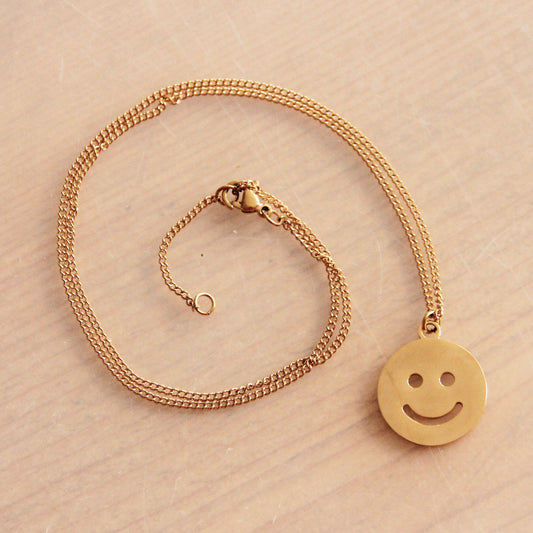 RVS fijne schakelketting met XL smiley – goud